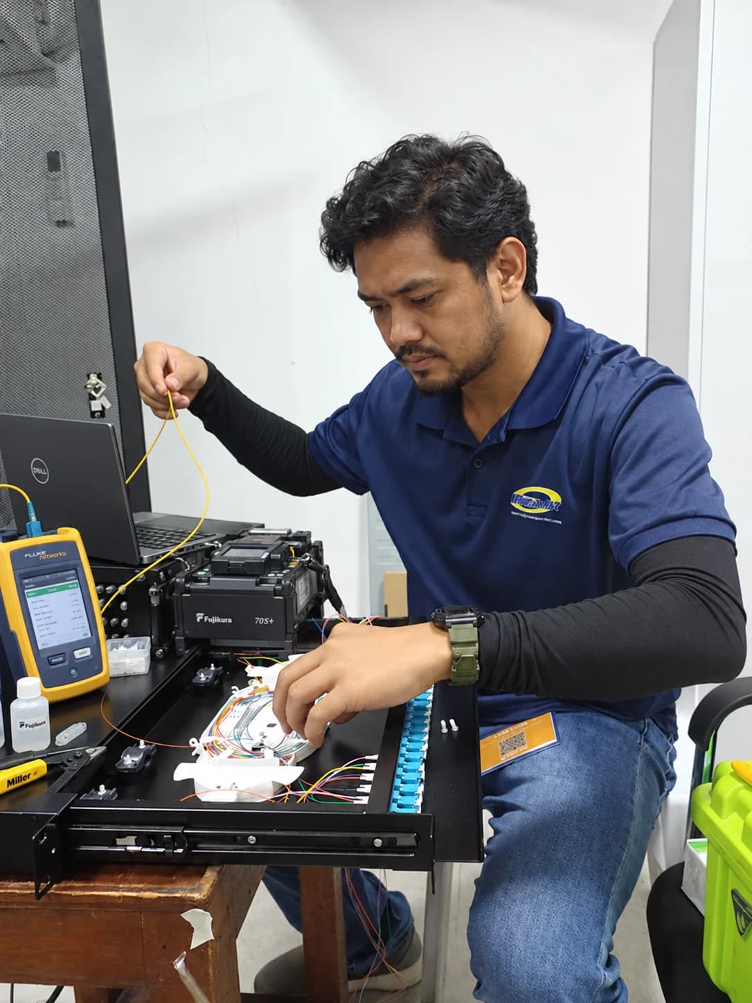 A technician working on fiber infrastructure